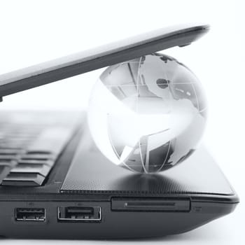 globe on a laptop keyboard