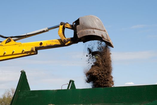 Excavator bucket with sand
