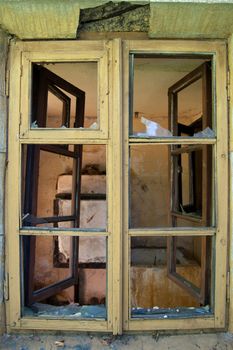 Broken window on an old abandonned  house