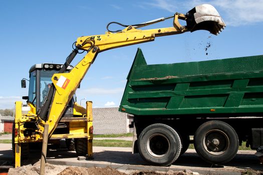 Excavator bucket with sand