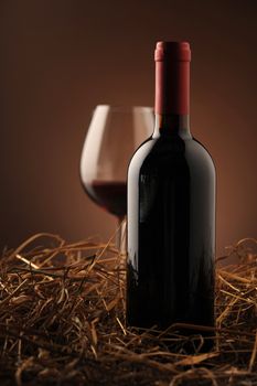 red wine and wine glass on a dark background