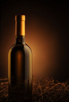 white wine bottle on a dark background