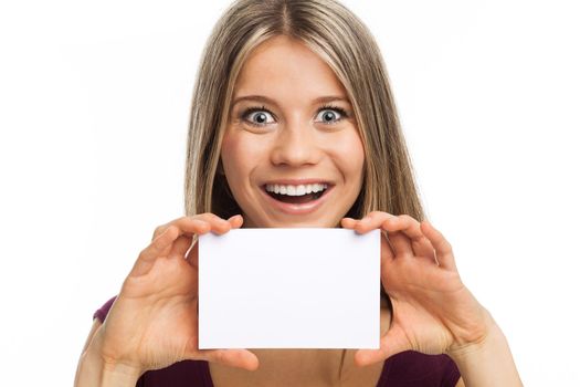 Close up portrait of a young woman showing a blank signboard, on white