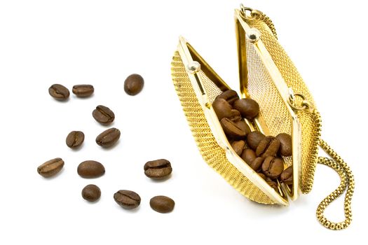 Gold  metallic purse with coffee beans isolated on white