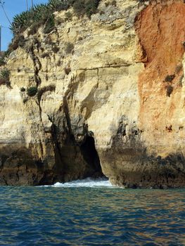 Caves and colourful rock formations on the Algarve coast in Portugal