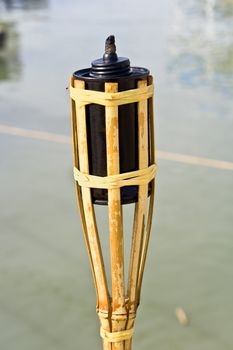 Bamboo torche near water