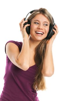 Happy young woman listening music with earphones, on white