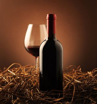 red wine and wine glass on a dark background