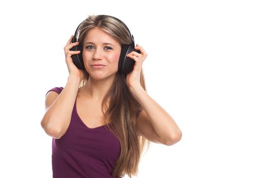 Happy young woman listening music with headphones, on white