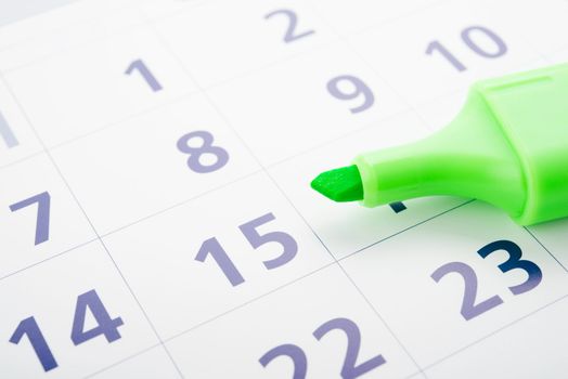Green marker and open calendar