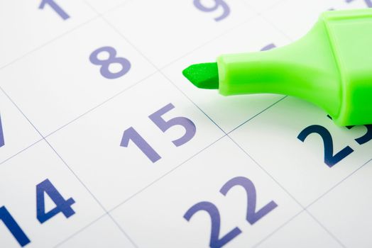 Green marker and open calendar