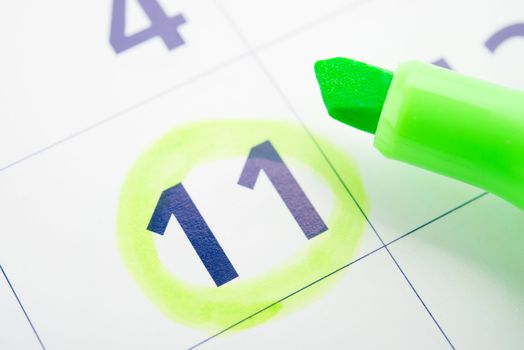 Green marker and open calendar