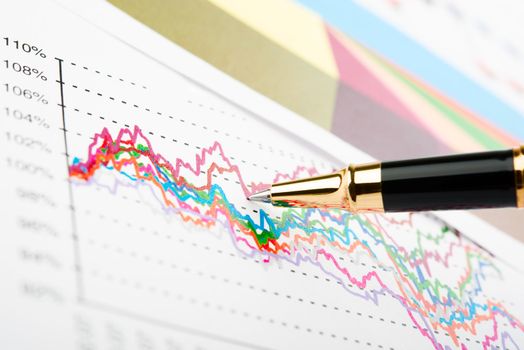 Pen showing a diagram on a report