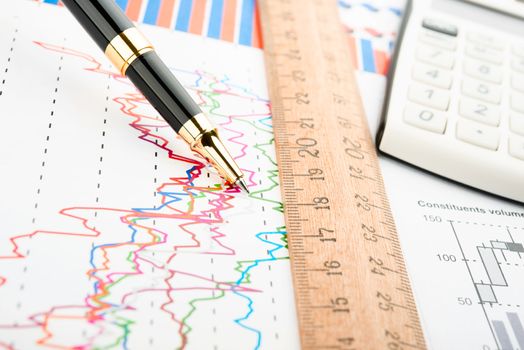 Pen showing a diagram on a report