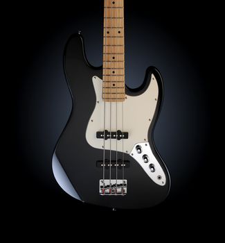 close up of a black electric bass glossy on dark background