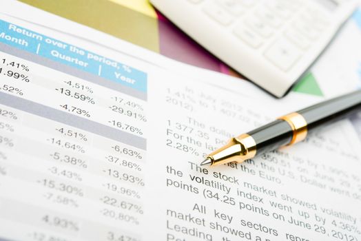 Pen showing a diagram on a report