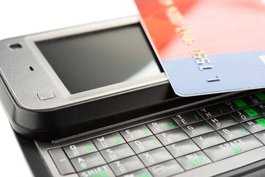 Close view of smartphone with credit card.