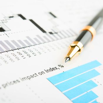 Pen showing a diagram on a report