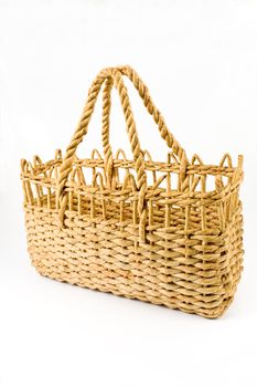 Straw shopping basket isolated on white