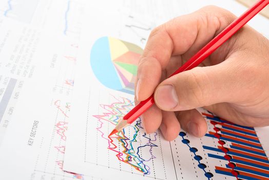 Analysing company year report with graphs and pencil