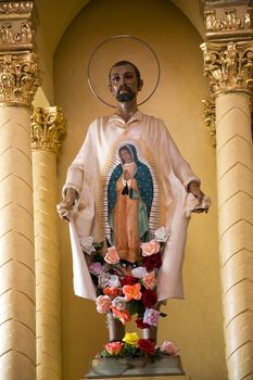 Old Statue of Indian Peasant Juan Diego revealing guadalupe painting to bishop Guadalupita Church, Morelia, Mexico