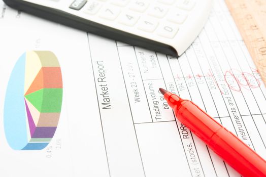 Company year report with graphs and pencil