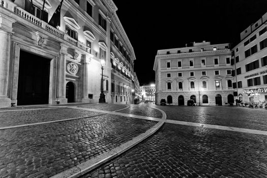 An empty and deserted cobble stone streets of Rome at night.