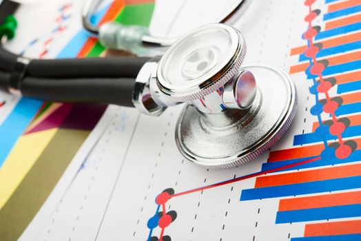 Stethoscope on a statistics graphic with graphs