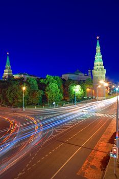 Kremlin Embankment and the Vodovzvodnaya (Water) Tower of the Moscow Kremlin at night. Shot from the Big Stone Bridge. Moscow, Russia.