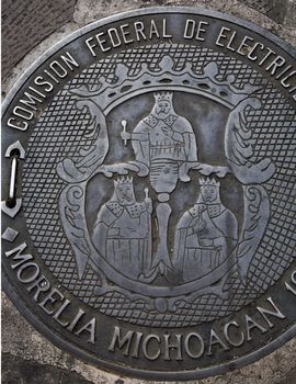 Government Seal of Three Kings Morelia Mexico on man hole cover in Morelia Street