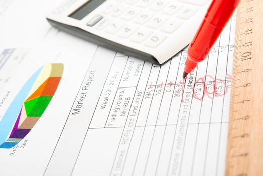 Company year report with graphs and pencil