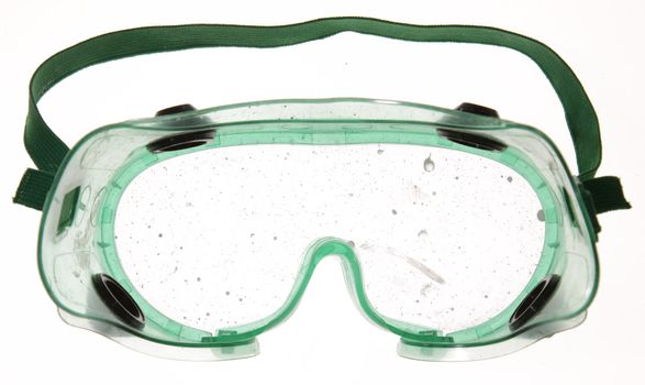 Goggles with paint drips on the lens. 