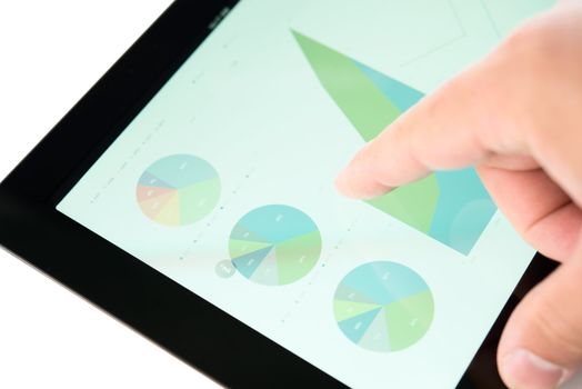 Finger touching stock market diagram on a tablet pc display