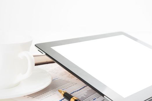 Tablet computer with blank screen on a businessman workplace