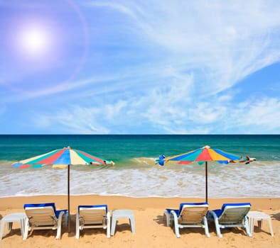 Colorful Umbrella and chair on the beach with sunny blue sky phuket Thailand