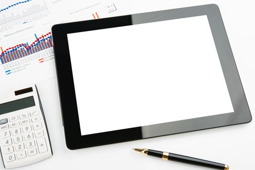 Tablet computer with blank screen on a businessman workplace