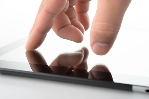 close view of hand on contemporary tablet pc