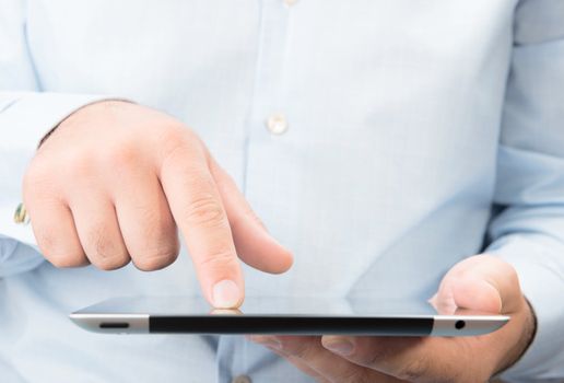 Man working on a digital tablet pc.
