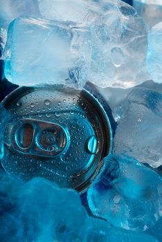 Closeup beverage can under ice under cold light