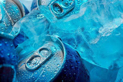 Macro shot of frozen drink cans and ice