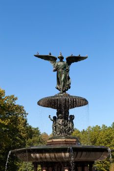 Fountain with an angel statue located in Central Park in New York City USA.