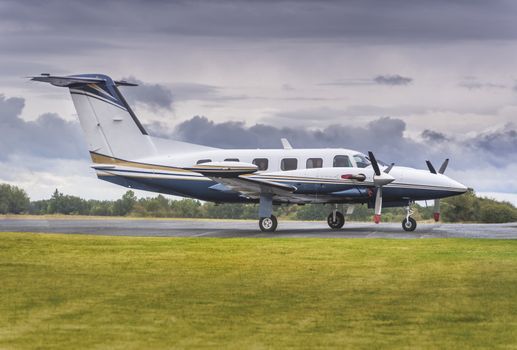 Private propeller plane parking at rural airport