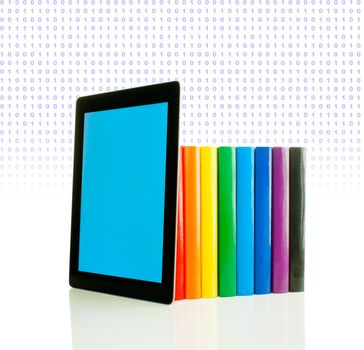 Row of colorful books and tablet PC over white background