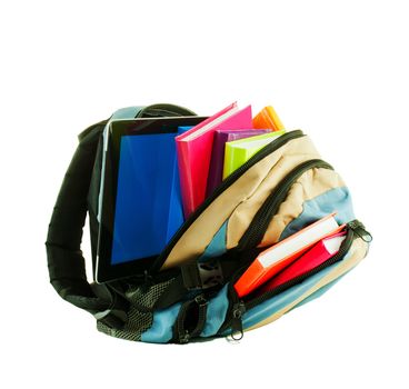 Backpack with colorful books and tablet PC against white background