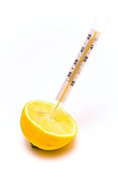Medical thermometer stuck into a slice of lemon isolated on white