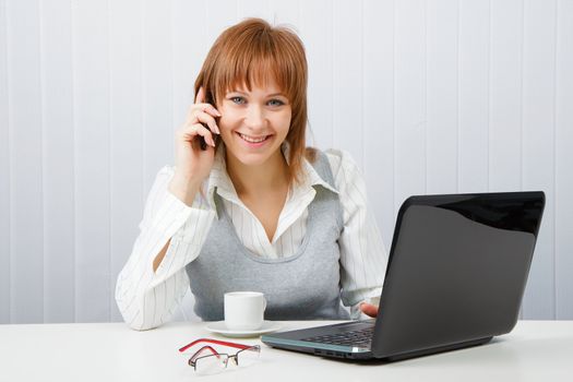 Attractive happy girl talking on the phone