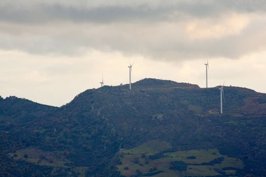 View of Wind turbines in the mountain with clouds