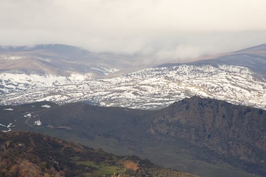 View of Monti Nebrodi with snow and clouds