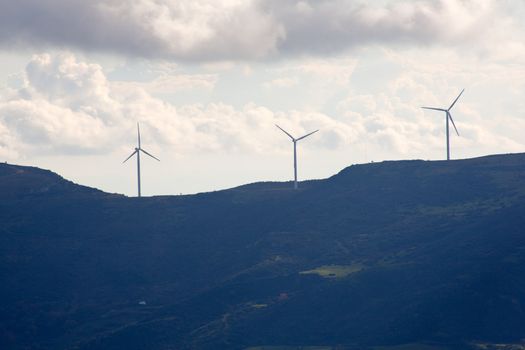 View of Wind turbines in the mountain with clouds