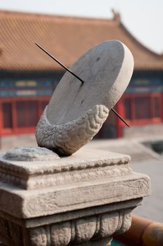 A stone sundial in a Chinese palace.